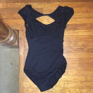 Black Bloch cap sleeve leotard.